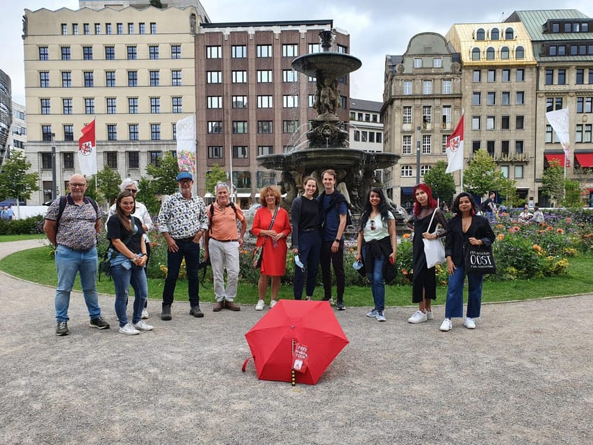 Explore Düsseldorf with Passionate tour guides! - Starting beneath the red umbrella at Leonidas
