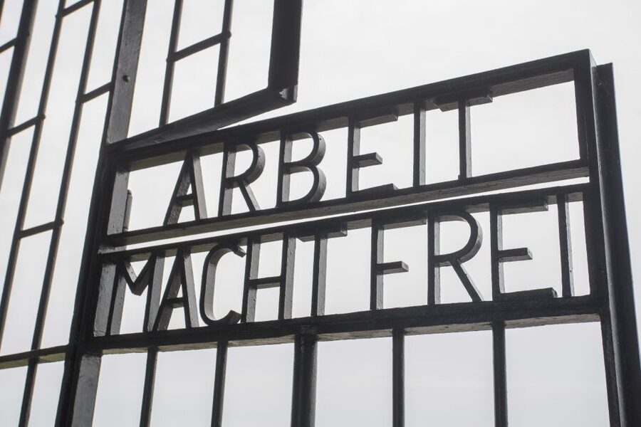 From Munich: Dachau Memorial Site Day Tour - Starting at Marienplatz with a guide in yellow