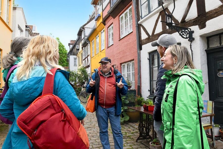 Lübeck: entertaining guided tour to old town highlights - Walking through Lübeck’s brick-built old town